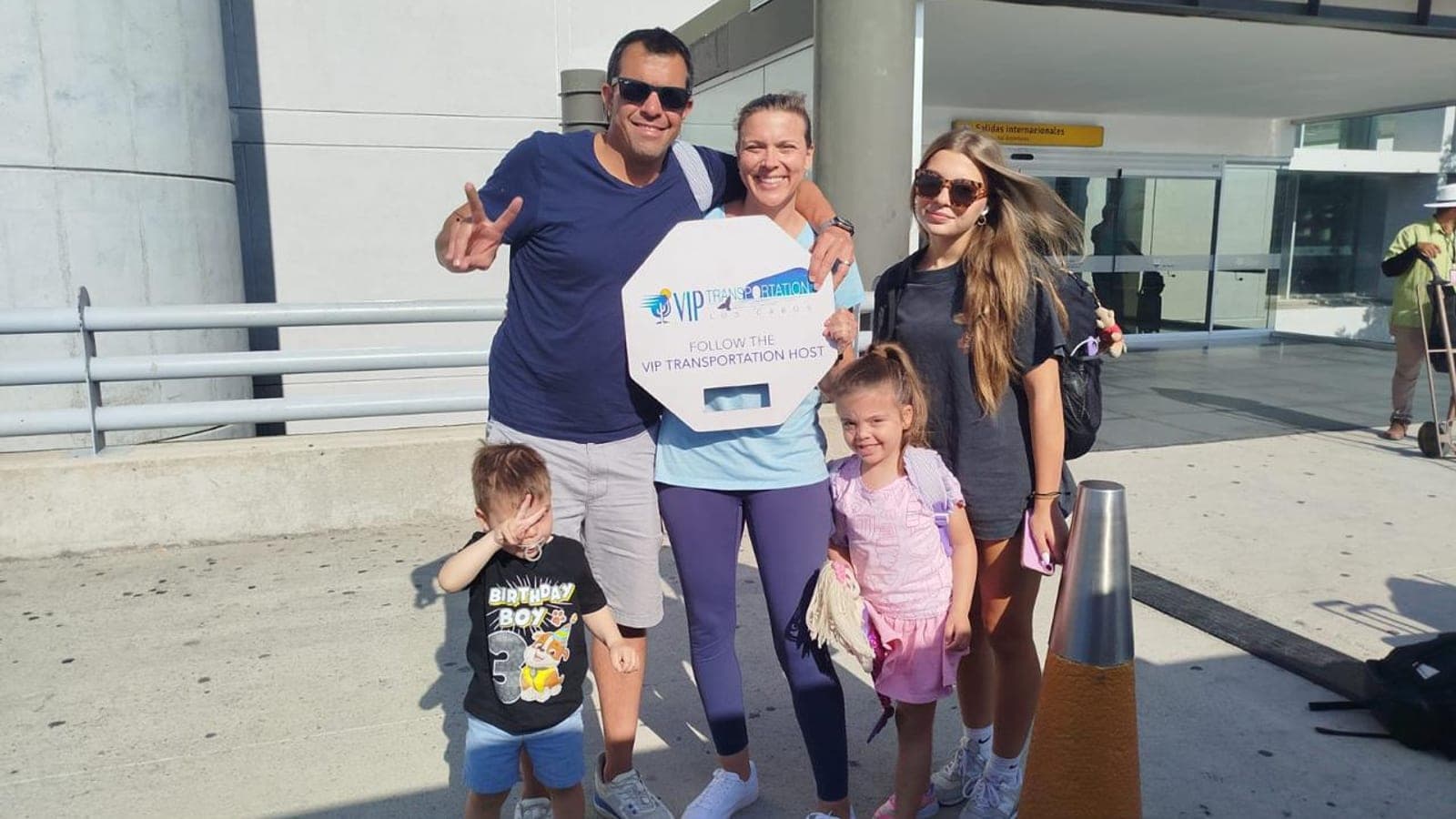 Family with young children greeted at SJD arrivals